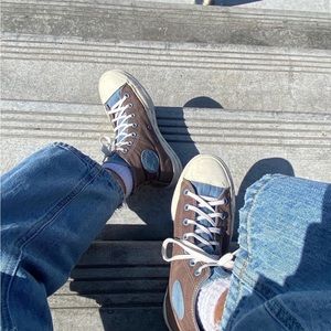 Brown and blue platform converse